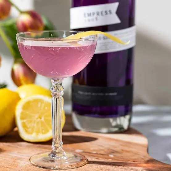 The Empress 0.0 75 mocktail, sparkling and violet, with a lemon twist