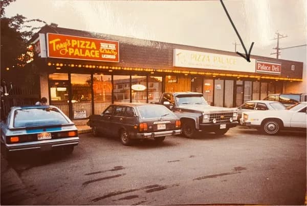 The Tony's Pizza Palace storefront and signage in the 1980s
