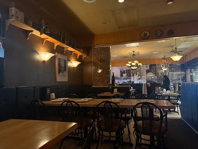 The dining room at Tony's, booths along the wall and tables set for service