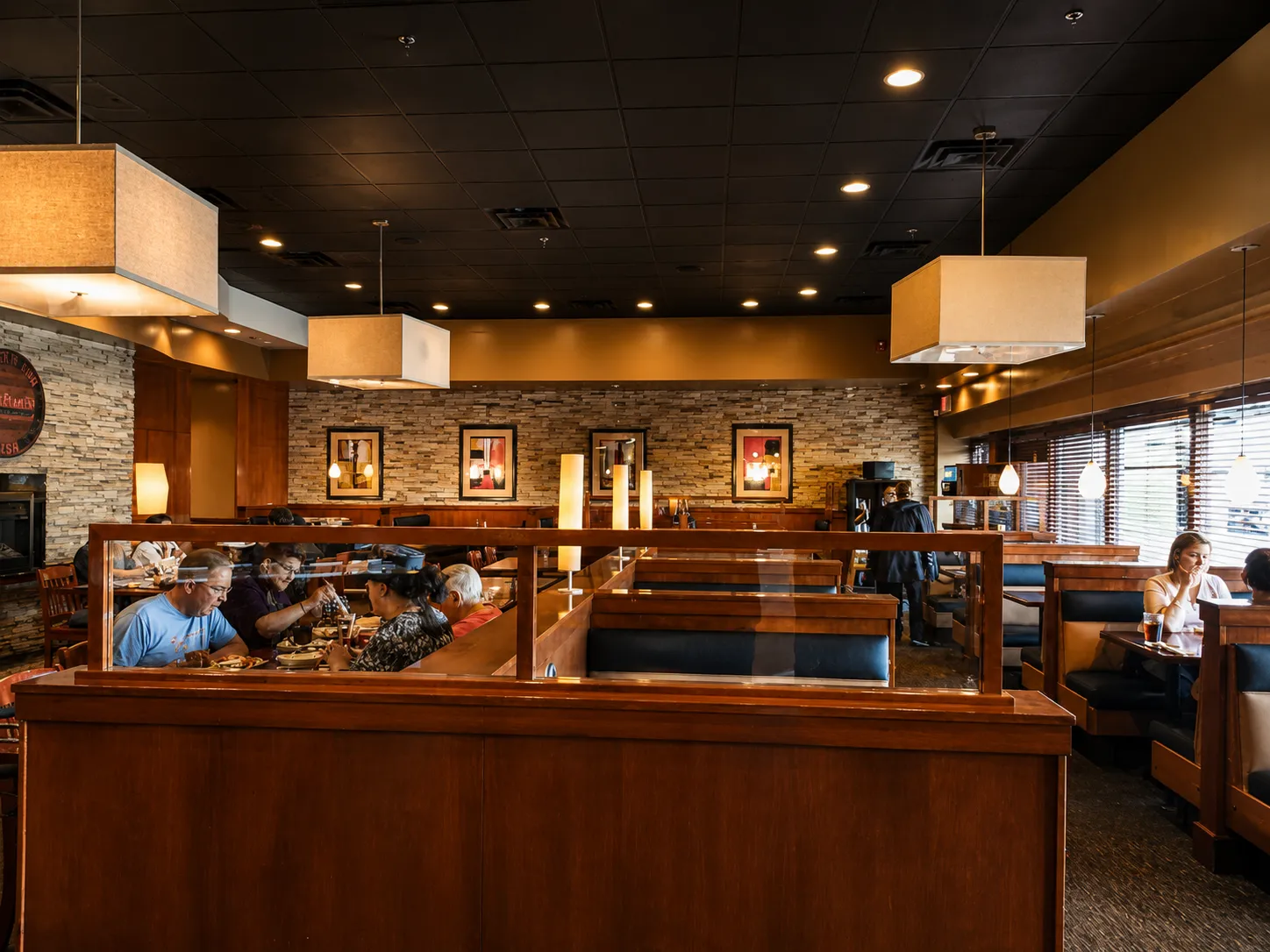 Inside Tony's Pizza Palace, dark wood and warm lighting
