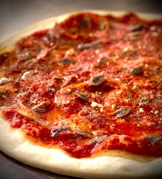 The Marinara — marinated tomato sauce, anchovies, garlic and spices, no cheese