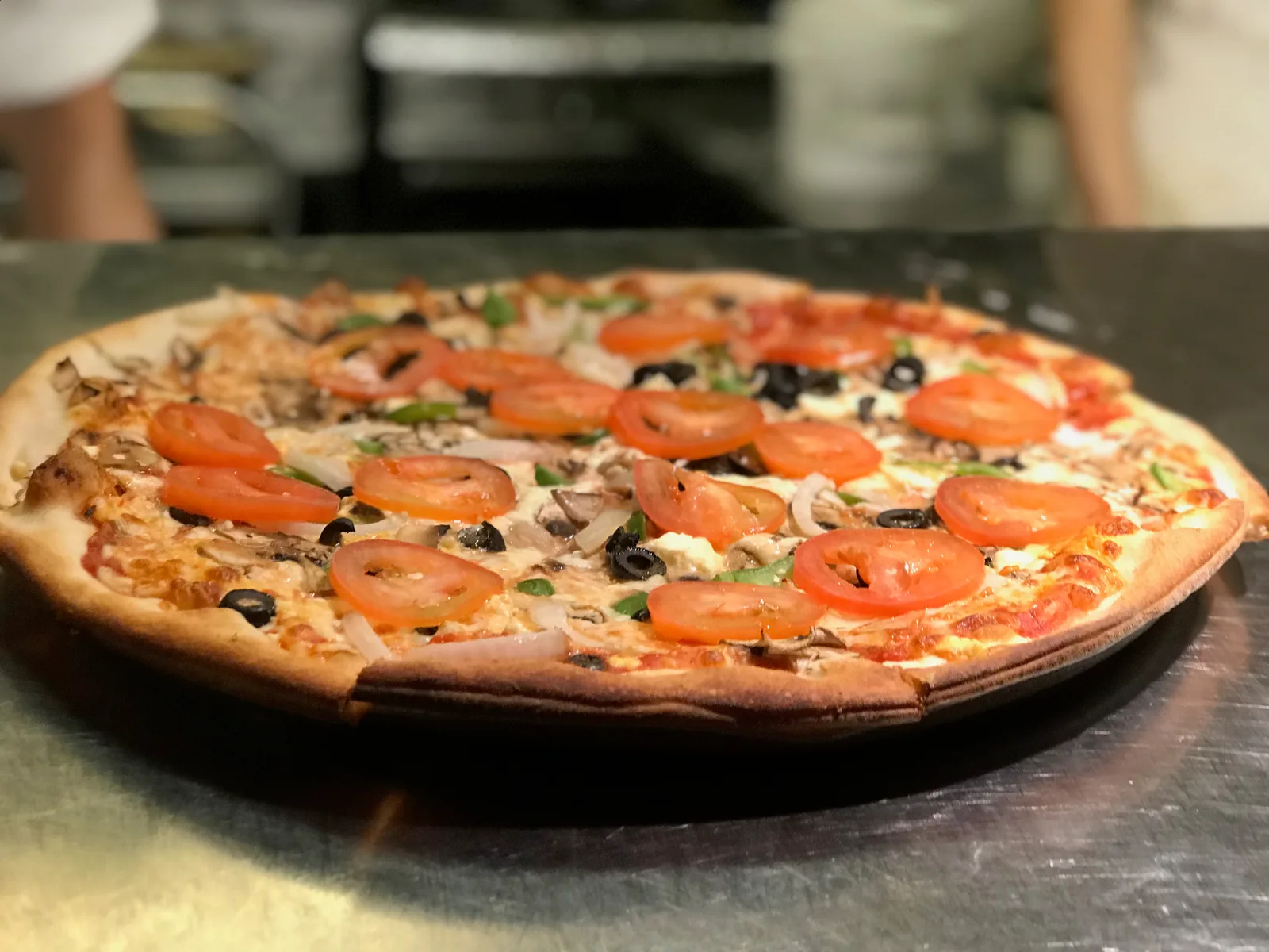 The Vegetarian — peppers, onions, tomato, olives, mushrooms and feta